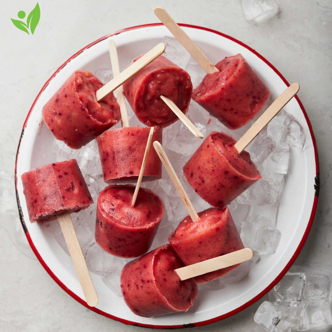 red fruit popsicles in a bowl of ice